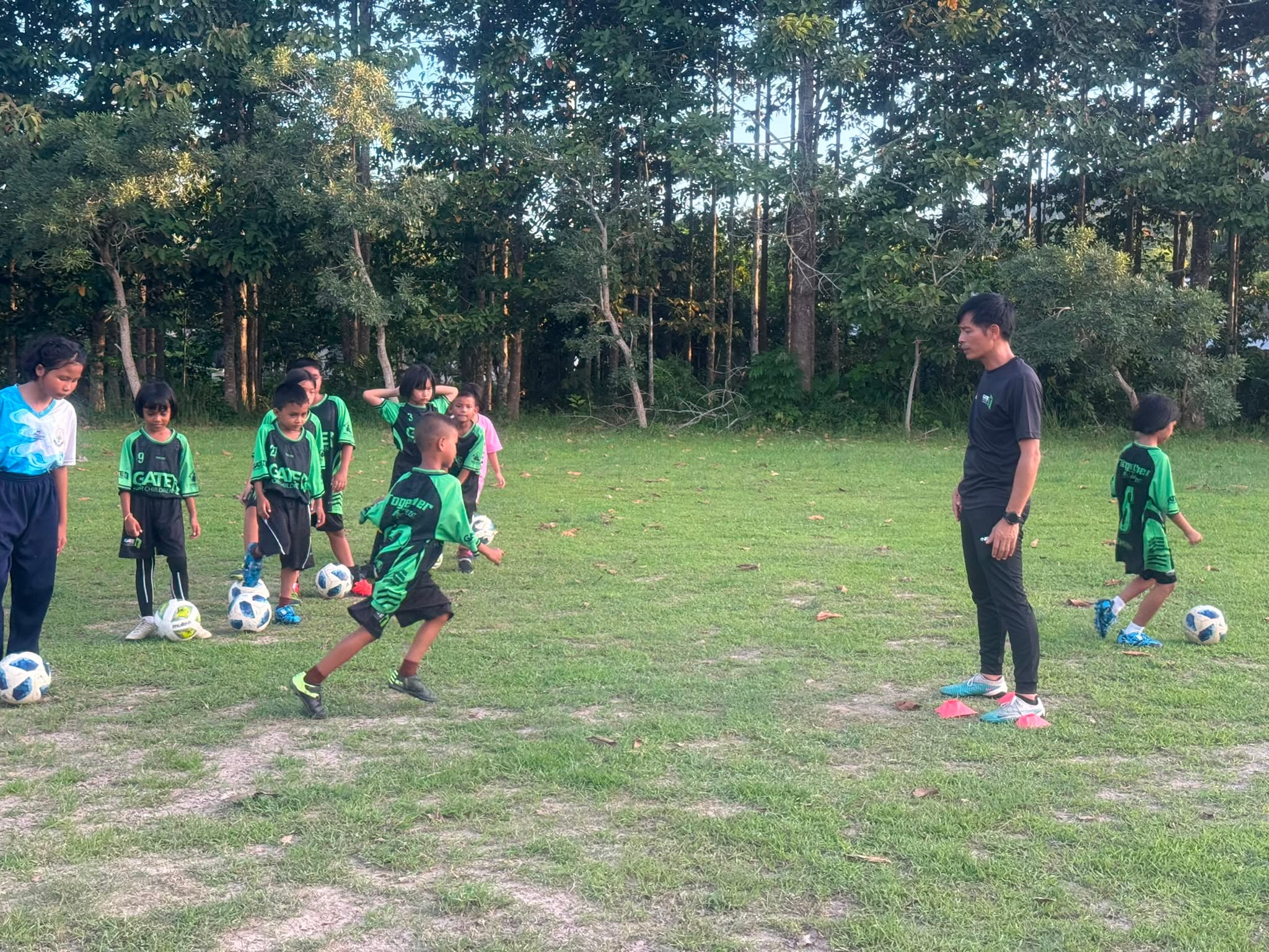 Children playing football at a Bridge for Future training session